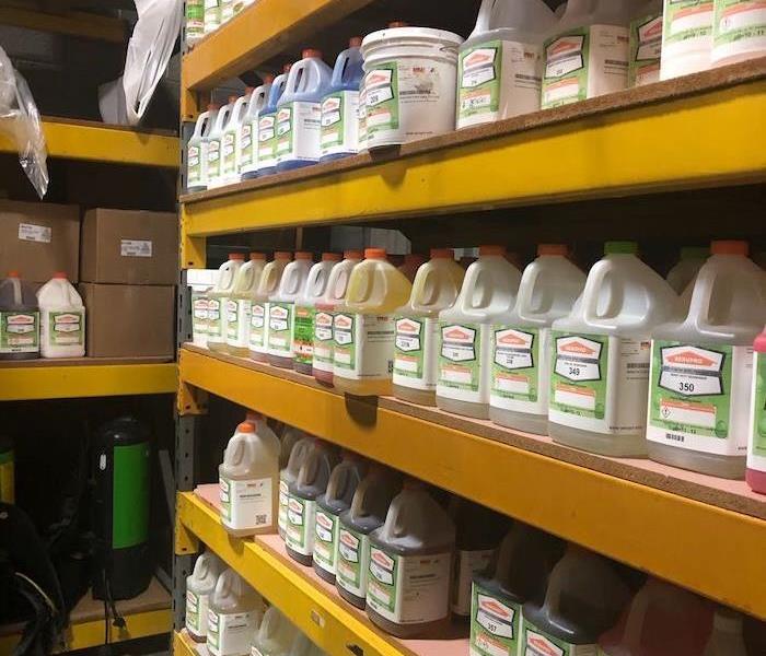SERVPRO cleaning solutions in storage on shelves