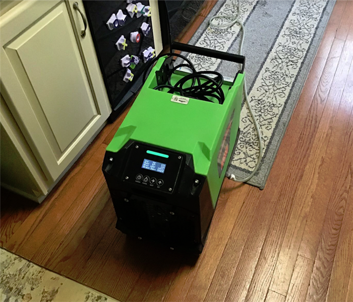 a SERVPRO appliance working in a home