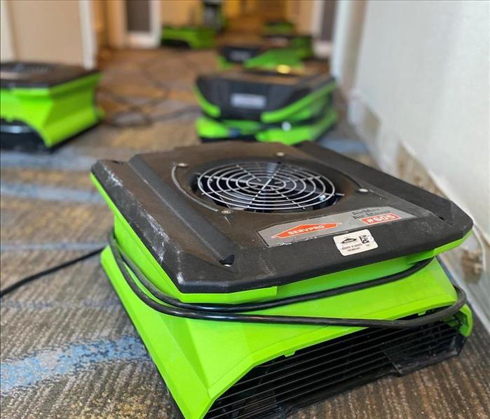 Up-close image of a SERVPRO air mover in a hallway